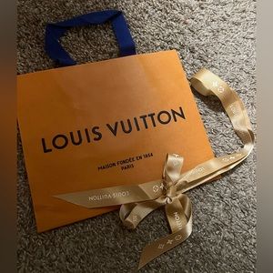 Louis Vuitton shopping bag and gold ribbon